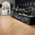 Champagne Oak loose lay lvp floors add warmth and contrast to a small chocolate shop