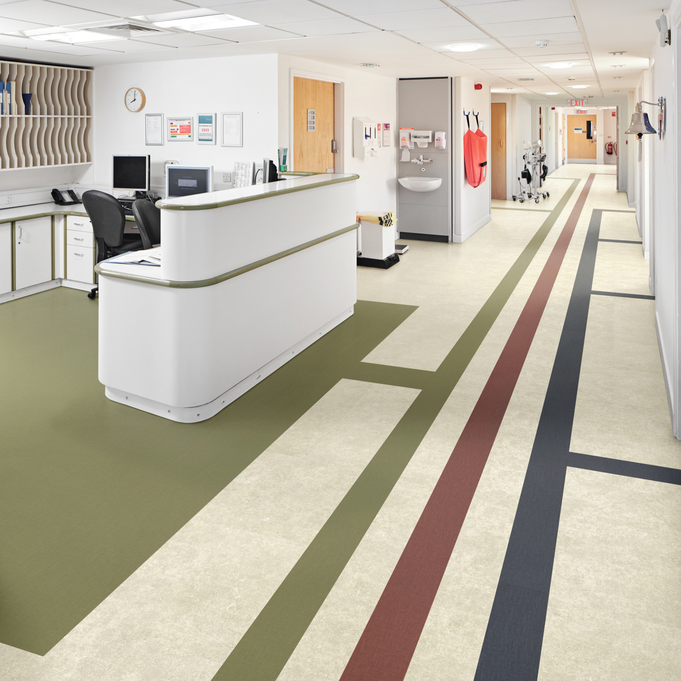 Opus gluedown abstract color lvt floors help direct people where to go in a hospital; featuring Toledo SP811, Burnt Sienna SP719, Indigo SP720 and Olive SP740