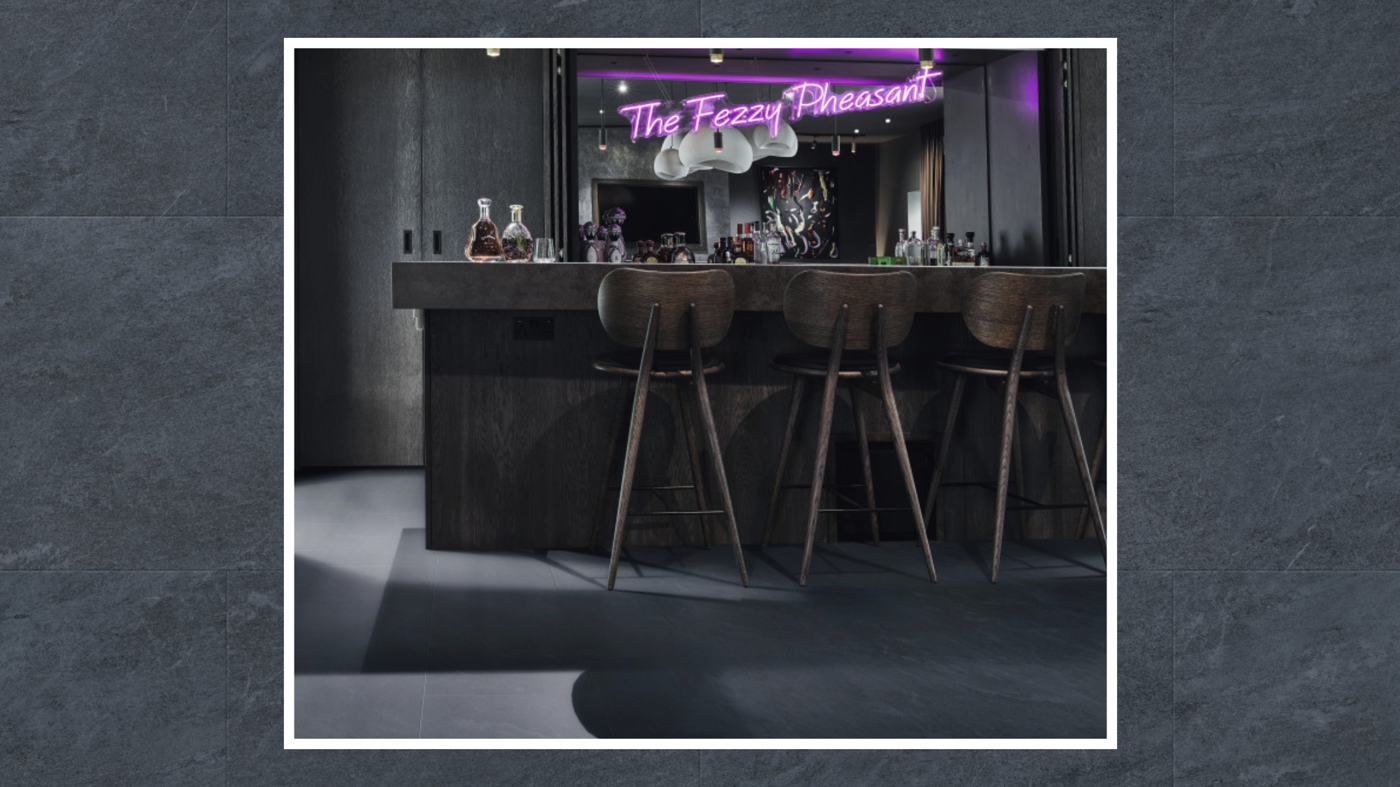 Lago Quartzite floors contribute to the bar's moody atmosphere 