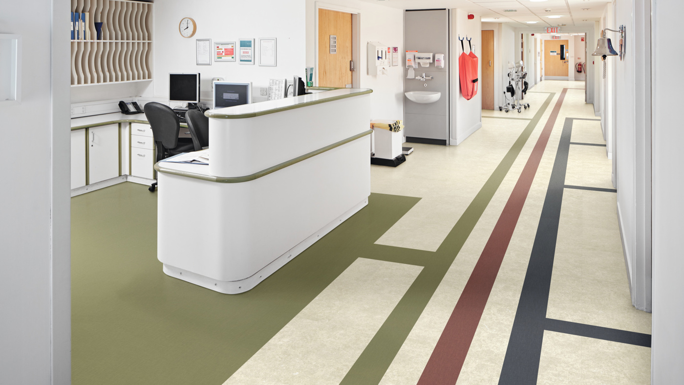 Wayfinding in a hospital using Burnt Sienna SP719, Indigo SP720 and Olive SP740 tiles on Toledo SP811 floors
