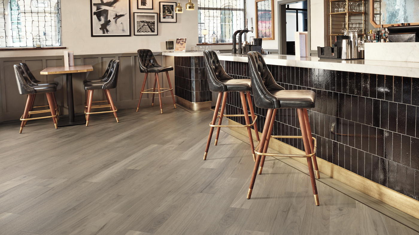 Bar and pub flooring with Bleached Grey Walnut lvp outlined by DS06-10 design strips