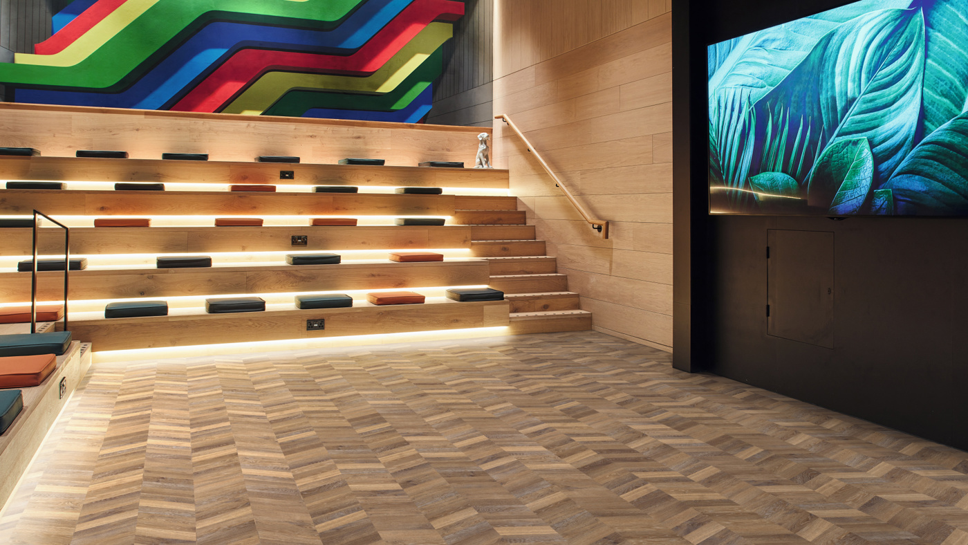 Mid Limed Oak chevron lvt floors in an auditorium