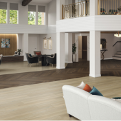 Basque Oak lvp floors with a Serrano Oak luxury vinyl herringbone pathway through the open space