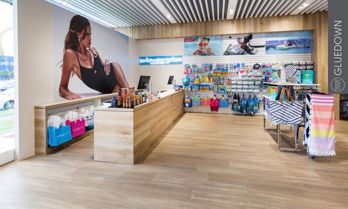 Van Gogh gluedown vinyl flooring in commercial retail spaces