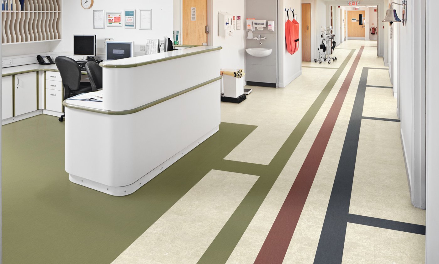 Opus gluedown abstract color lvt floors help direct people where to go in a hospital; featuring Toledo SP811, Burnt Sienna SP719, Indigo SP720 and Olive SP740