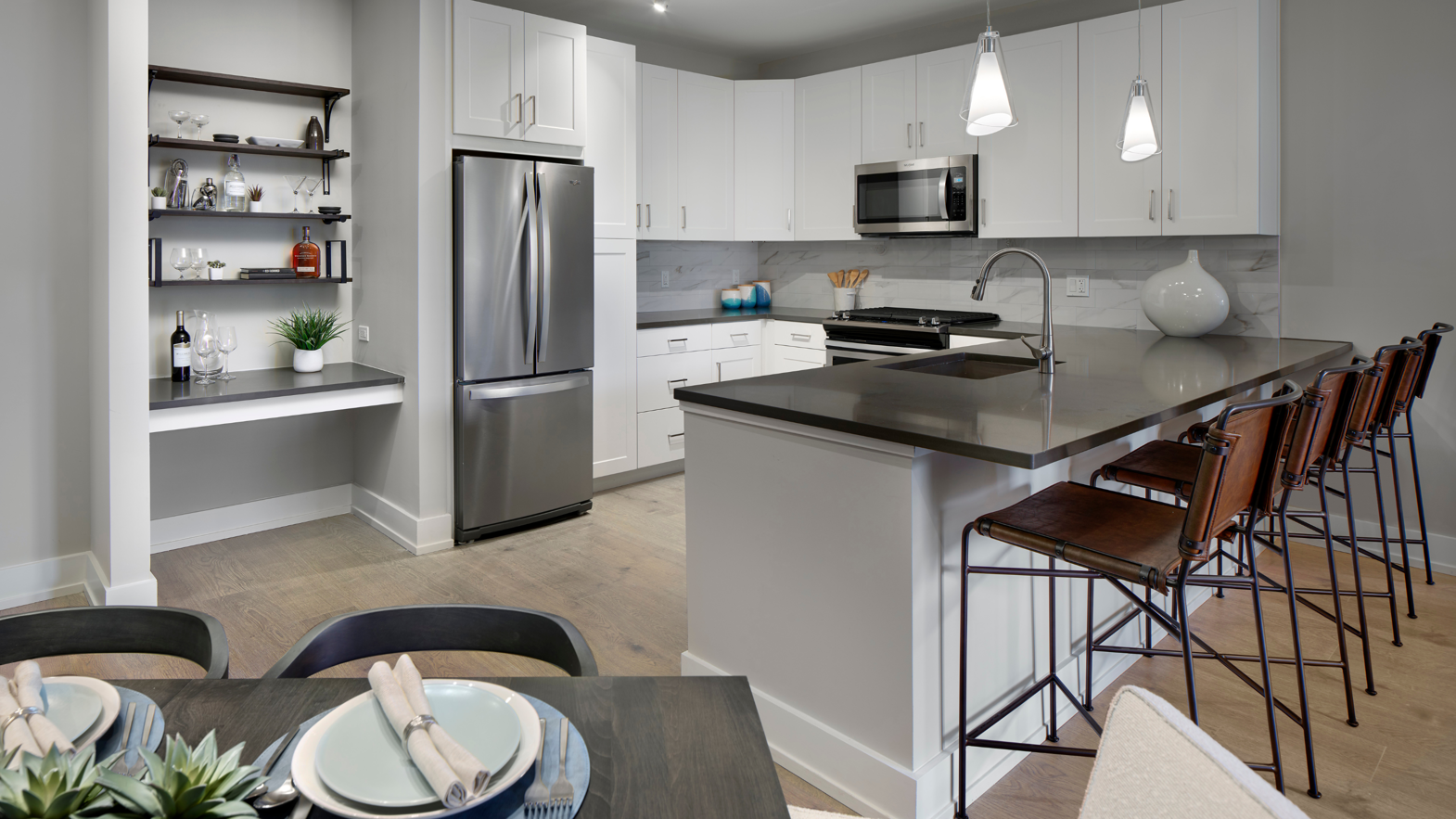Smoked Butternut Korlok Select floors in an apartment kitchen at AVE's Blue Bell, PA location