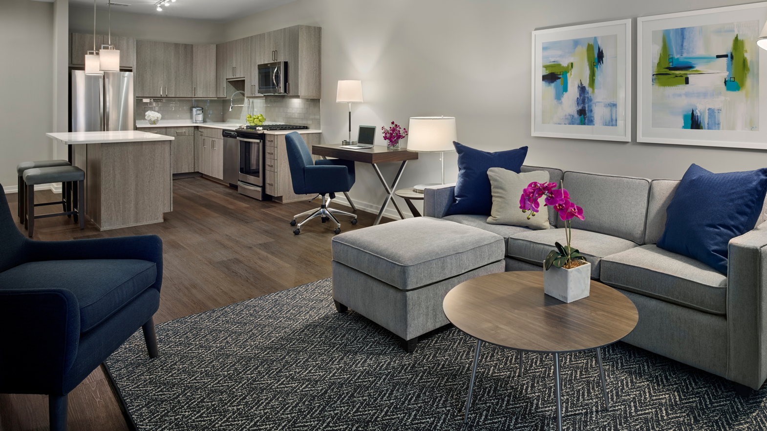 Washed Velevt Ash lvt floors in an apartment living room and kitchen at AVE King of Prussia