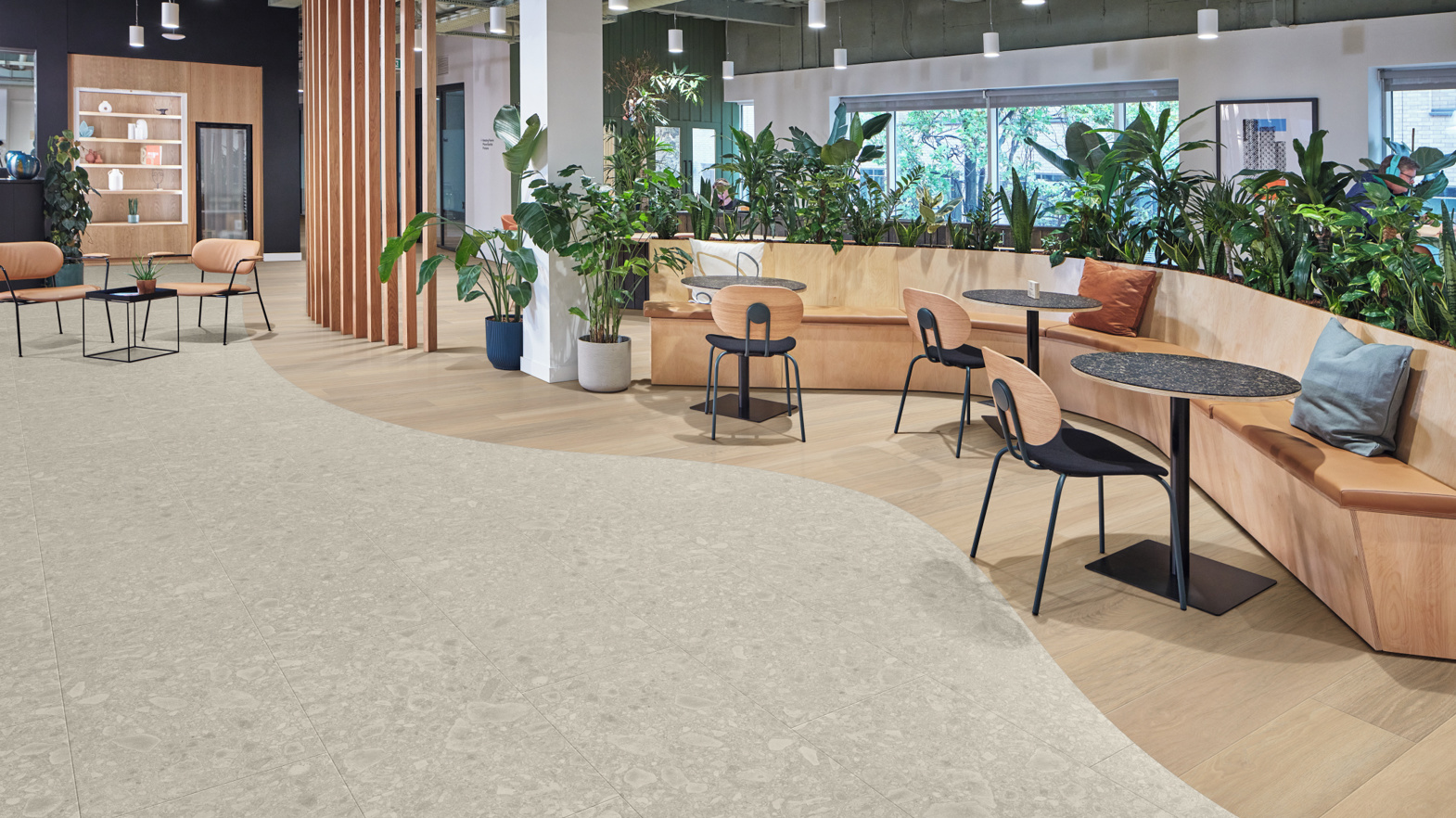 Dune Oak RL24 and Brezza Ceppo LM43 gluedown lvt floor used to zone a commercial space