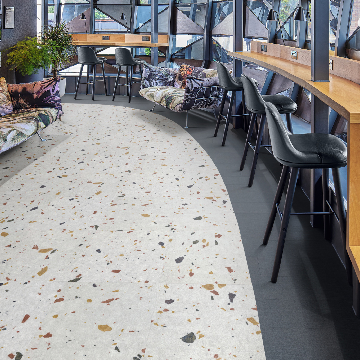 Office working space with Salute Grisio SP118 lvt floors surrounded by an Indigo SP720 border