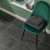 Knight Tile Black Riven Slate black LVT flooring with a chair