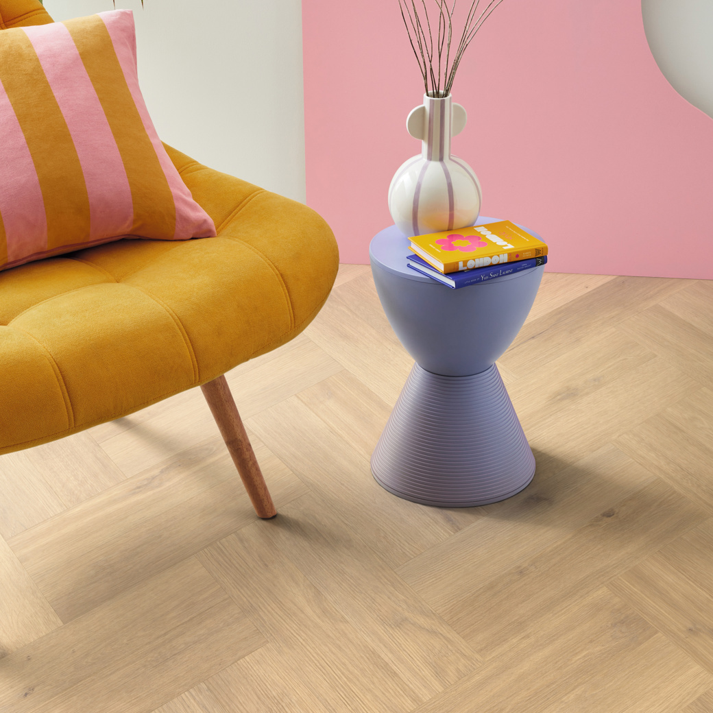 Van Gogh Canadian Nude Oak mid brown lv flooring in a corner of a room next to a yellow chair